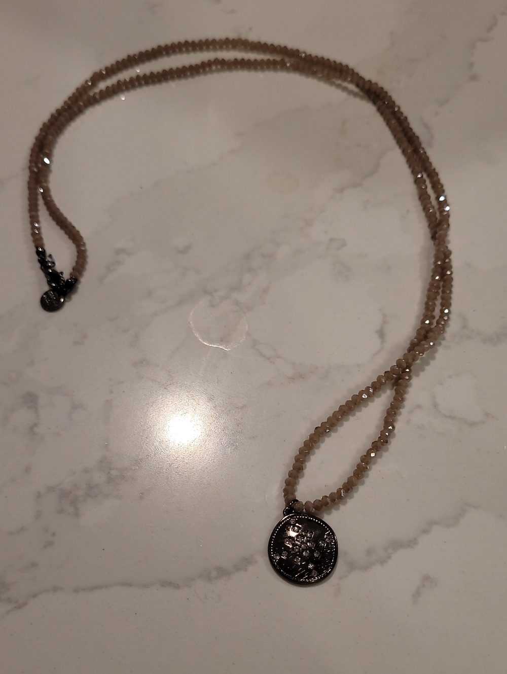 Marlyn Schiff Beige Faceted Bead Necklace with Silver Coin Charm